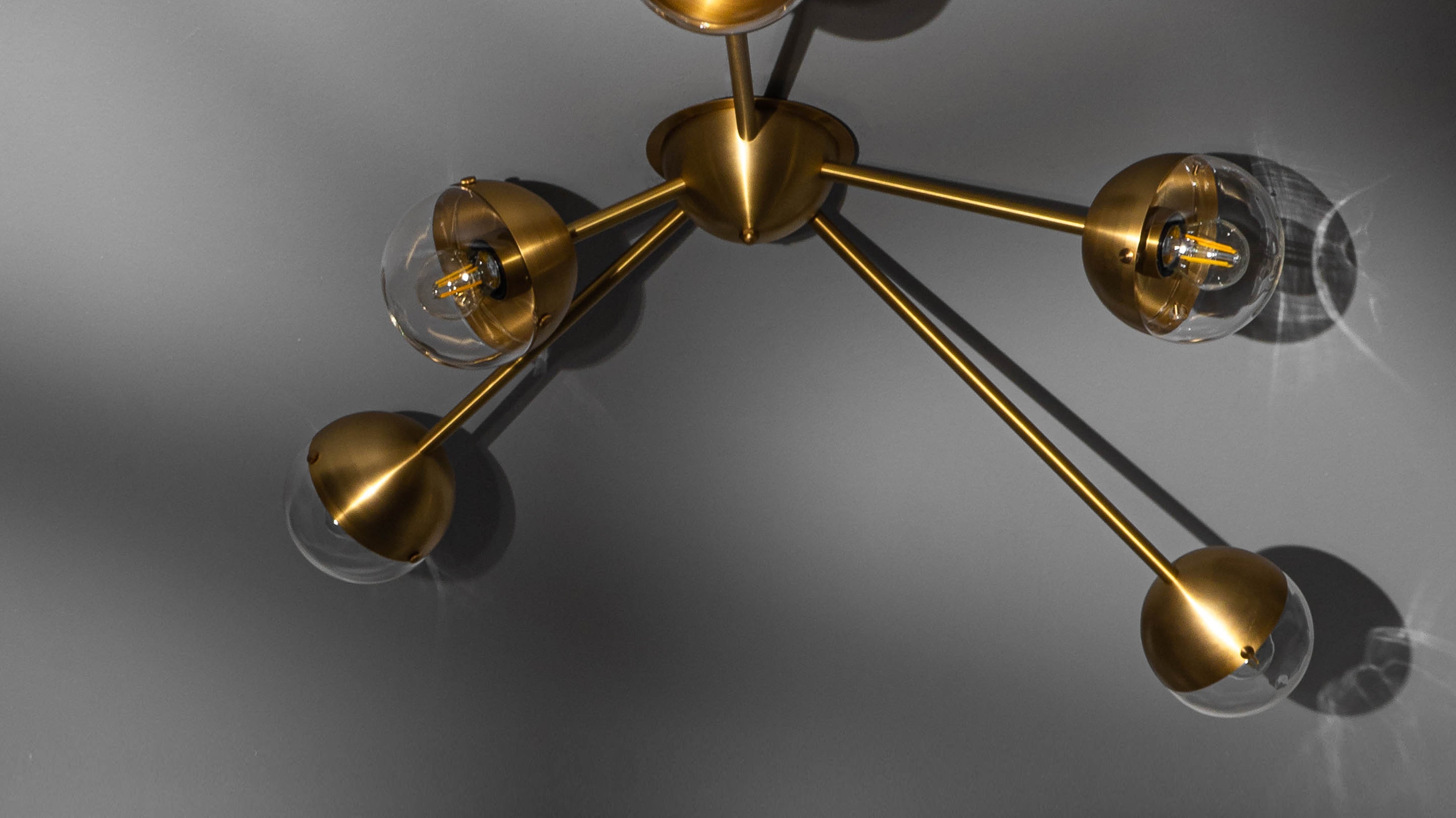 Schwung Molecule Spark Burnished Brass Transparent Ceiling/Wall Light